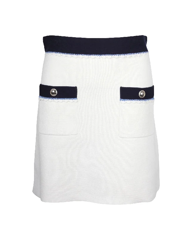 Women's Cozy SkirtsMaje Oliana Button-Embellished Two-Tone  Mini Skirt in Black and White Cotton